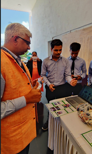 Dr. Abhay Jere reviewing a student prototype